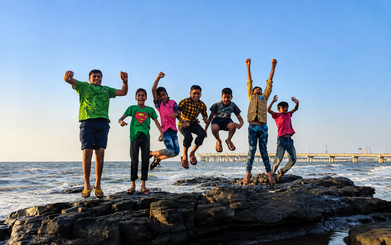Children enjoying time together by the sea
