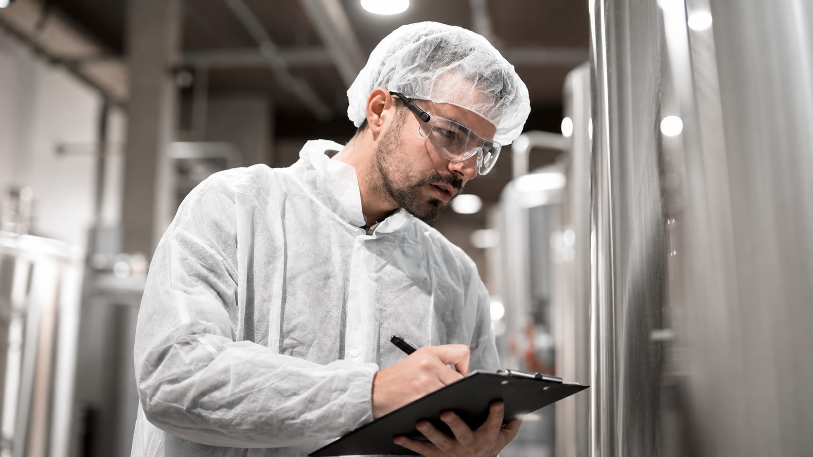 Cold chain specialist inspecting controlled storage equipment
